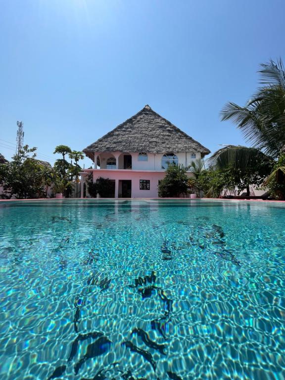 a house in the middle of a pool of water at Villa Euphoria - Adults Only in Paje