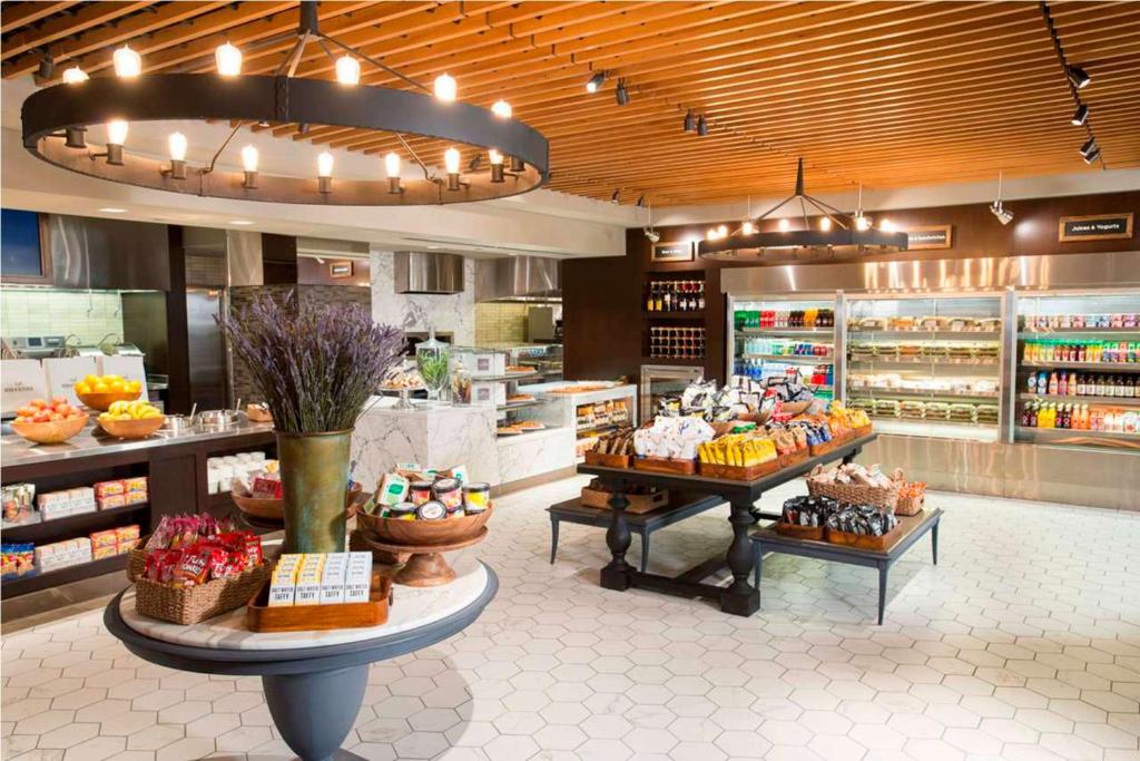 a store filled with lots of different types of food at New York Hilton Midtown in New York