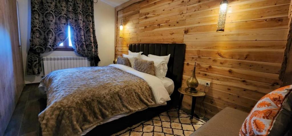 Postel nebo postele na pokoji v ubytování Chalets-Appartements Tourtite