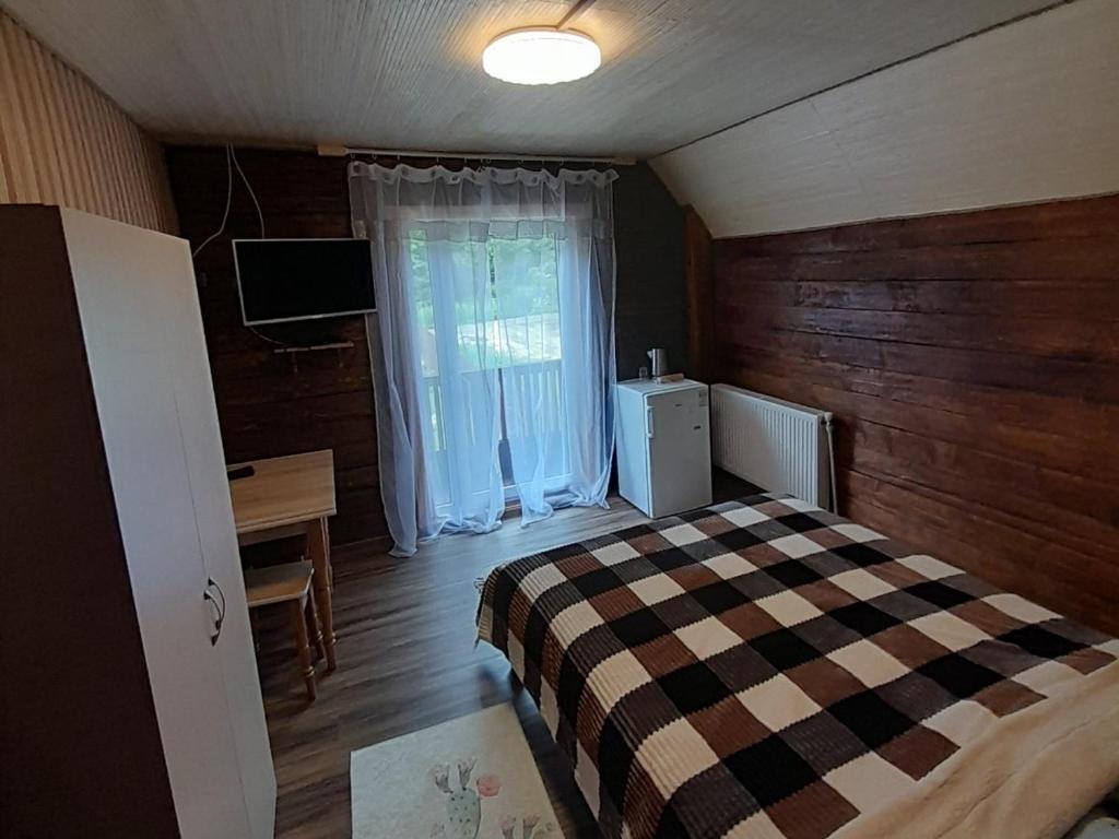 Postel nebo postele na pokoji v ubytování Садиба Срібний Вовк