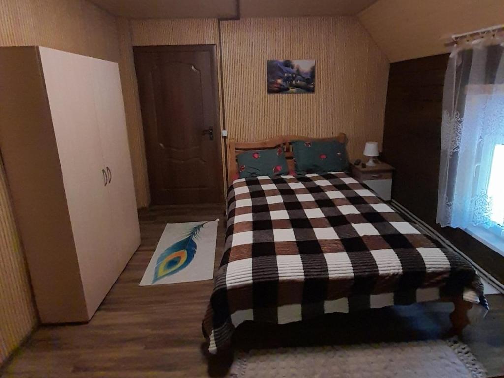 Postel nebo postele na pokoji v ubytování Садиба Срібний Вовк