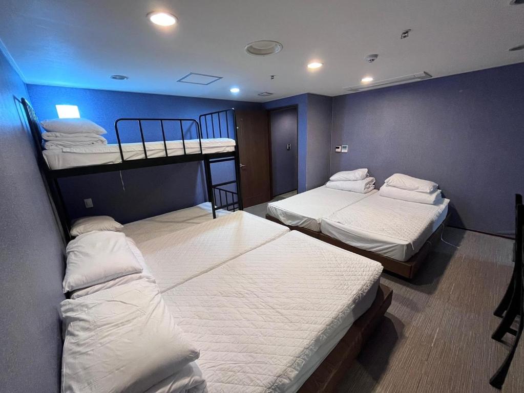 Postel nebo postele na pokoji v ubytování Soosong Guesthouse