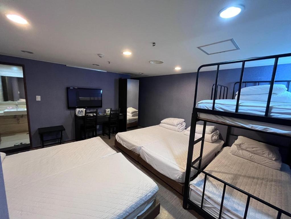 Postel nebo postele na pokoji v ubytování Soosong Guesthouse