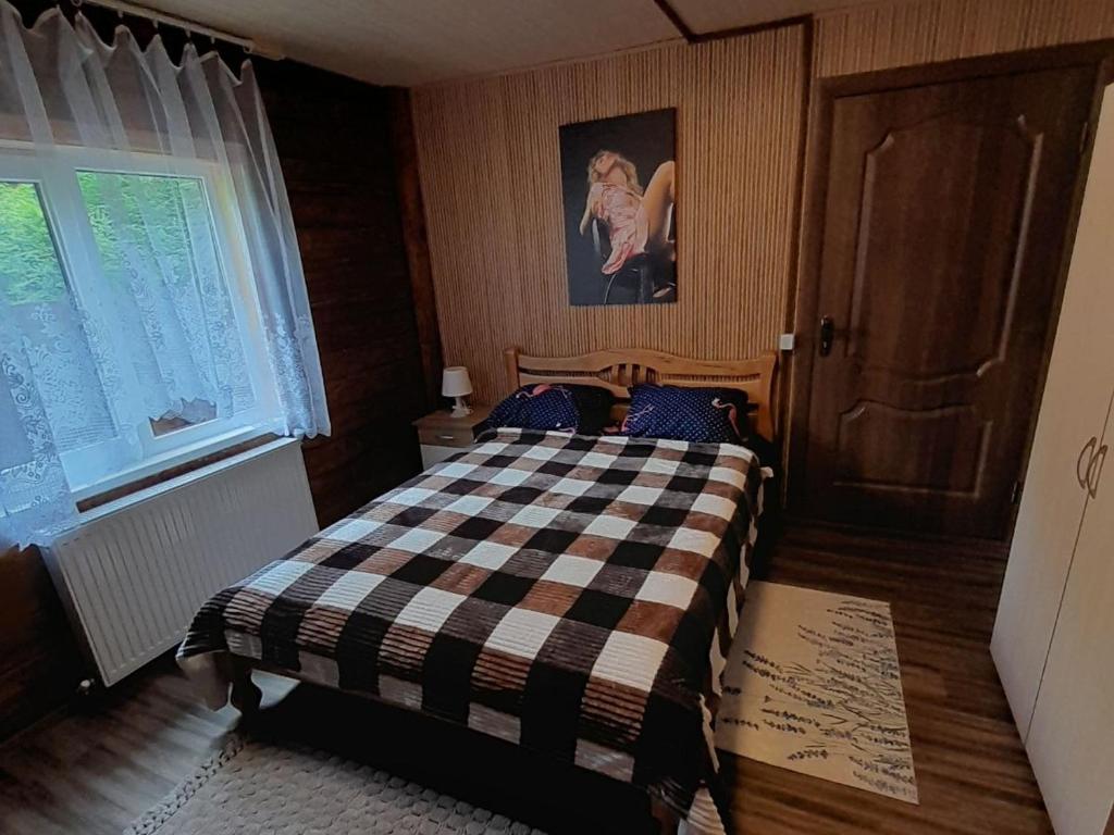 Postel nebo postele na pokoji v ubytování Садиба Срібний Вовк