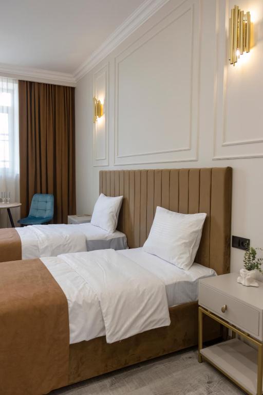 Postel nebo postele na pokoji v ubytování Parvana Guest House