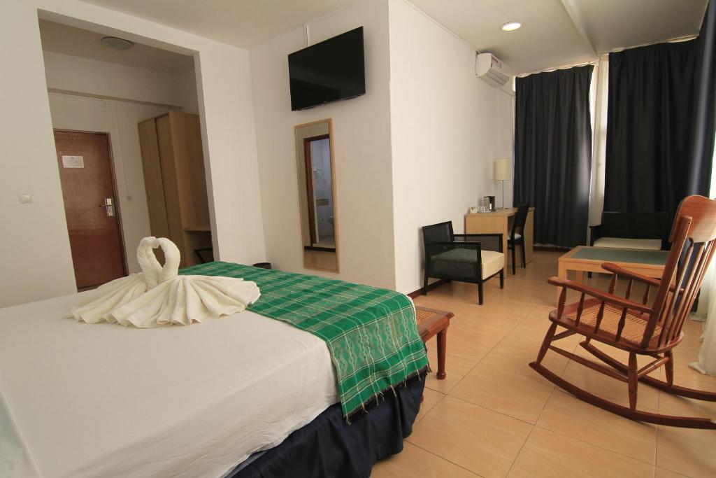 Postel nebo postele na pokoji v ubytování Hotel Santa Maria