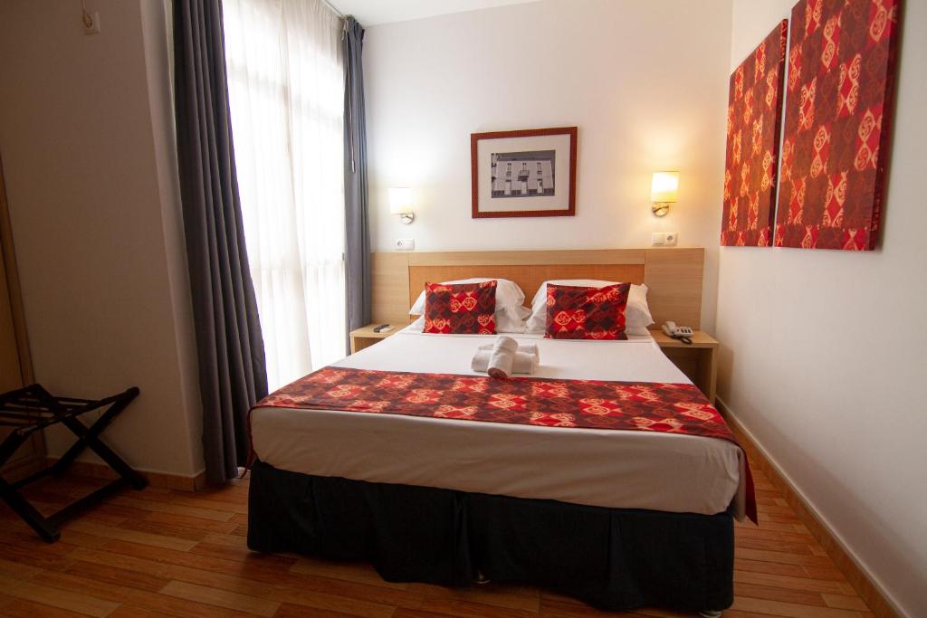 Postel nebo postele na pokoji v ubytování Hotel Santa Maria