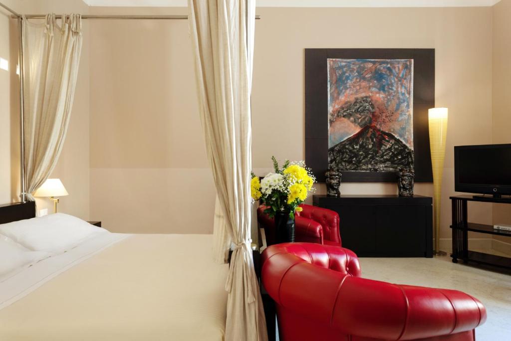 Postel nebo postele na pokoji v ubytování Palazzo Brunaccini Boutique Hotel
