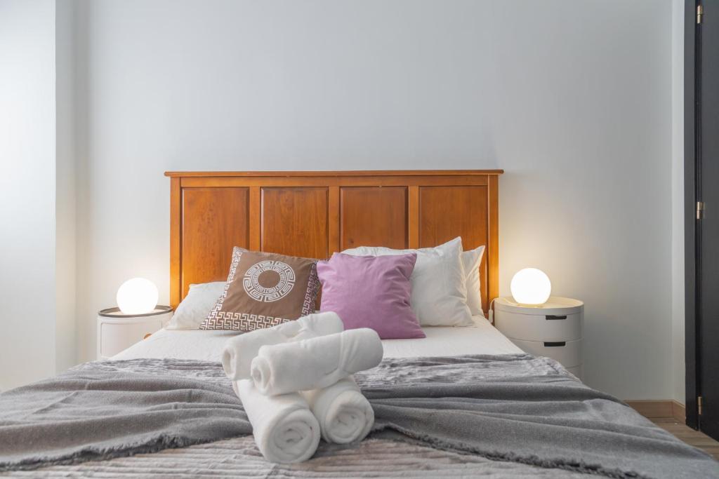 Postel nebo postele na pokoji v ubytování Exclusivo Maria de Molina
