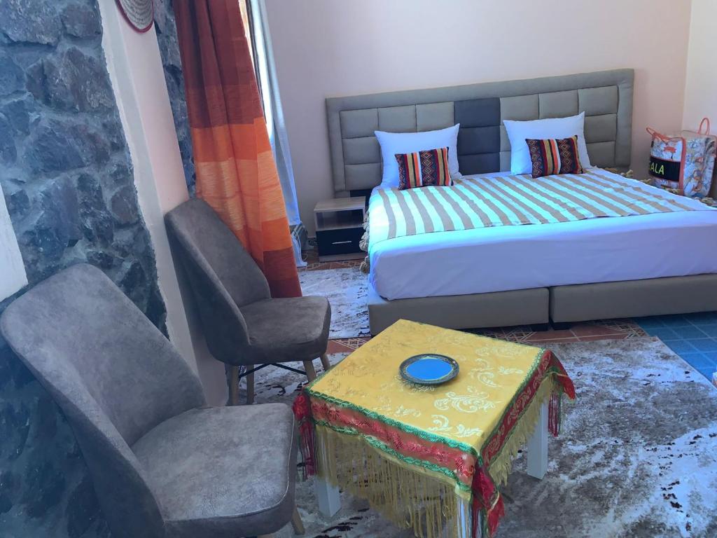 Postel nebo postele na pokoji v ubytování Oussaya House