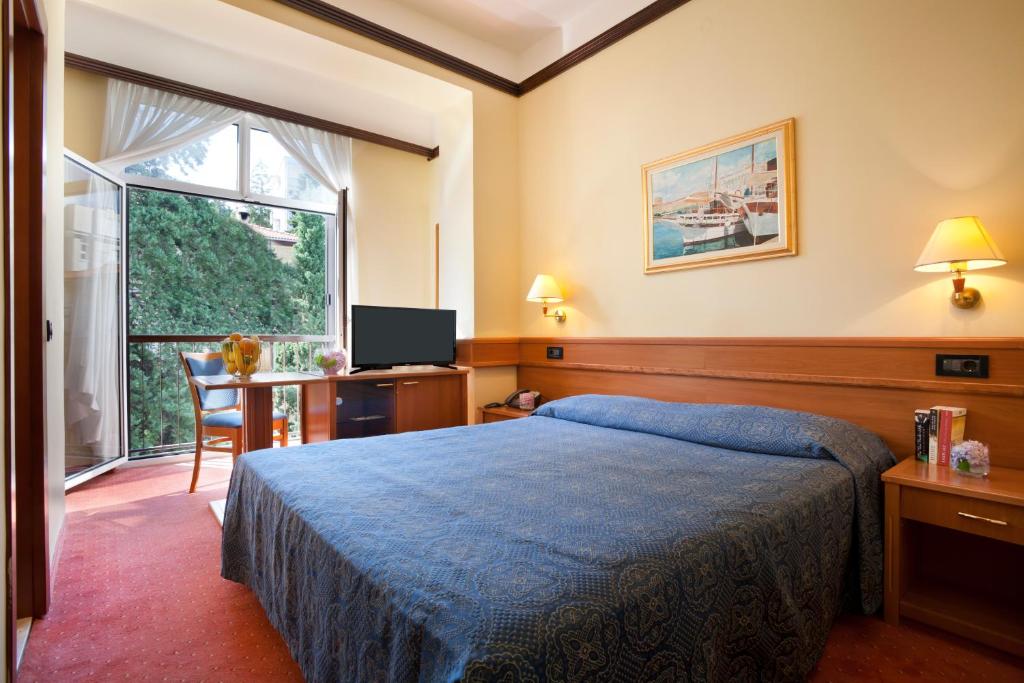 Posteľ alebo postele v izbe v ubytovaní Hotel Kristal - Liburnia