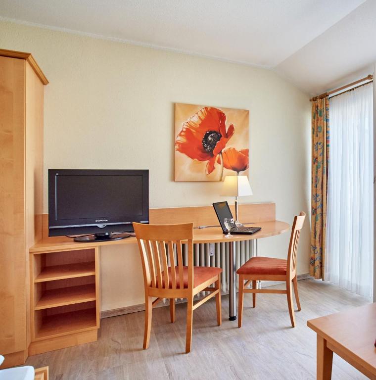 TV a/nebo společenská místnost v ubytování Apparthotel Minerva Diana Octavia