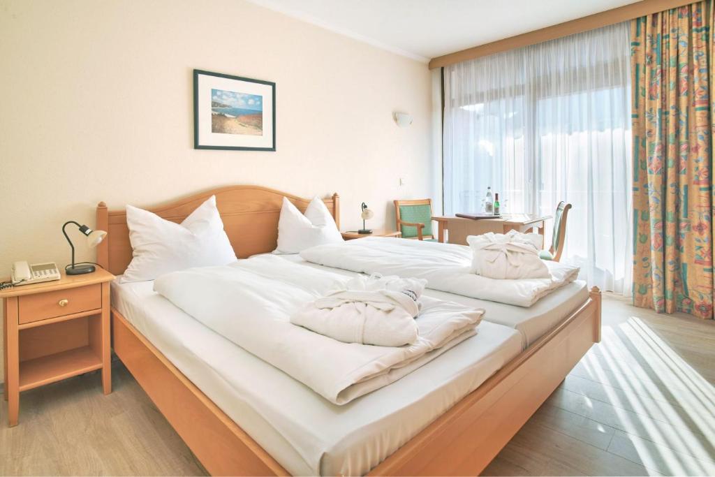 Postel nebo postele na pokoji v ubytování Apparthotel Minerva Diana Octavia