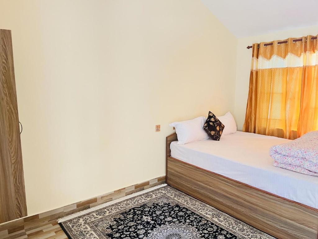 Letto o letti in una camera di Prashiddha Resort
