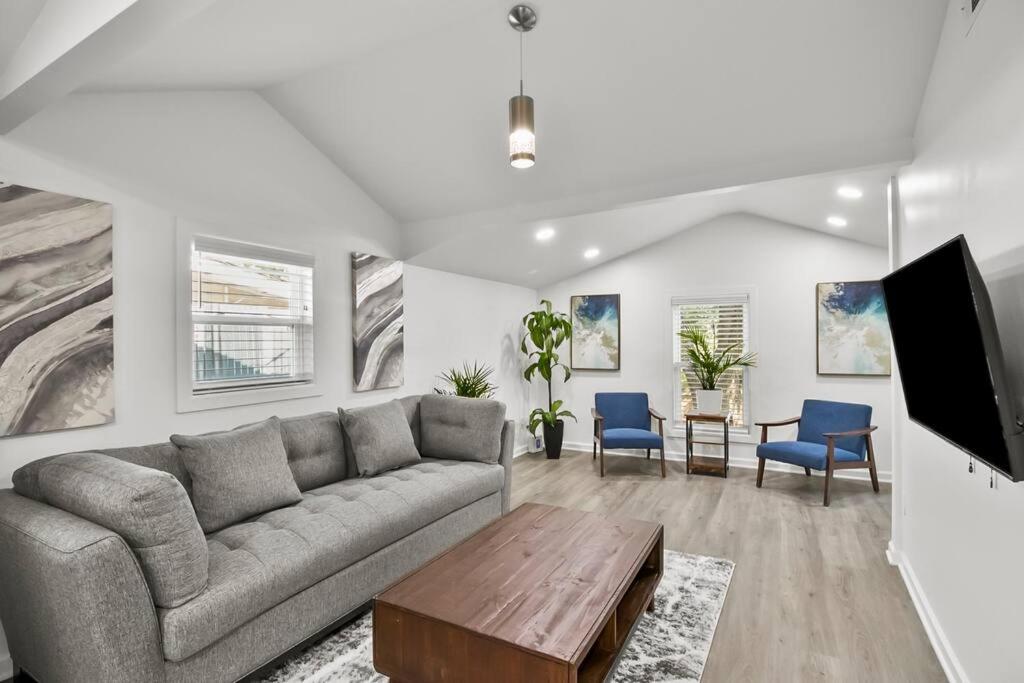 a living room with a couch and a table at Spacious & Charming House in Heart of Atlanta in Atlanta