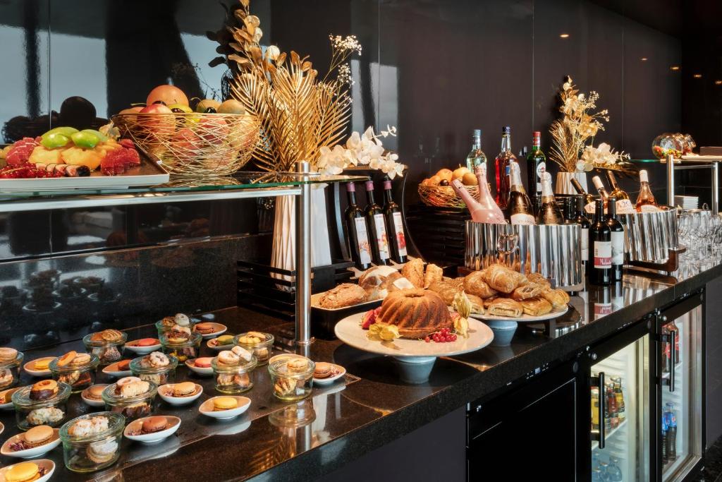 a buffet with many different types of food and drinks at Melia Vienna in Vienna