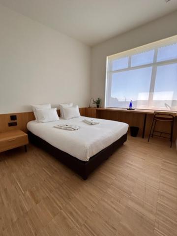 Postel nebo postele na pokoji v ubytování Hotond Sporthotel