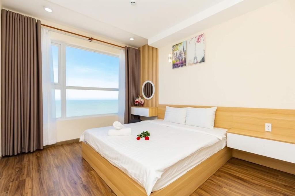 Giường trong phòng chung tại Vung Tau Gold Sea Apartment