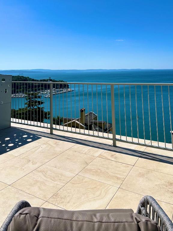 a view of the ocean from a balcony at Maximilian Suites in Trieste