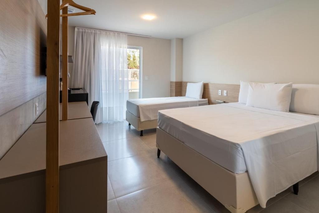 Postel nebo postele na pokoji v ubytování Liiv Mar - Natal Ponta Negra