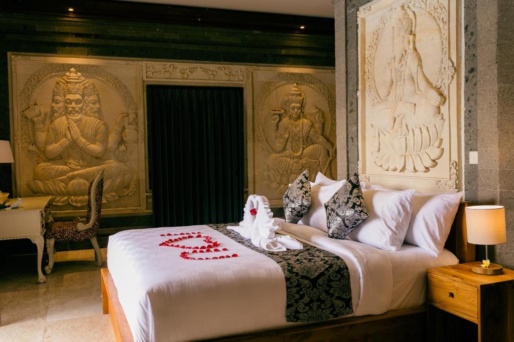 Postel nebo postele na pokoji v ubytování Arbathu Villa Ubud