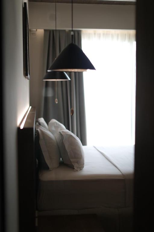 Postel nebo postele na pokoji v ubytování Drymades Inn Resort