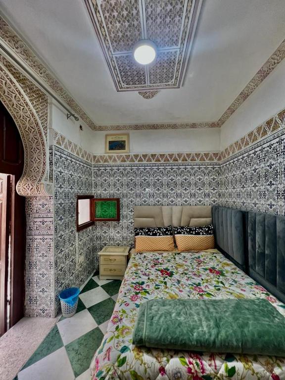 Postel nebo postele na pokoji v ubytování Riad Le Palais