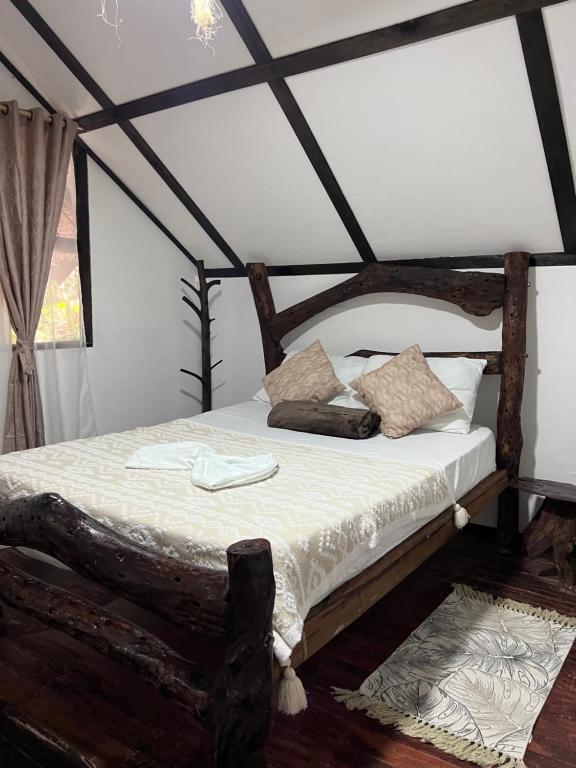Postel nebo postele na pokoji v ubytování Monte Verde Hostal