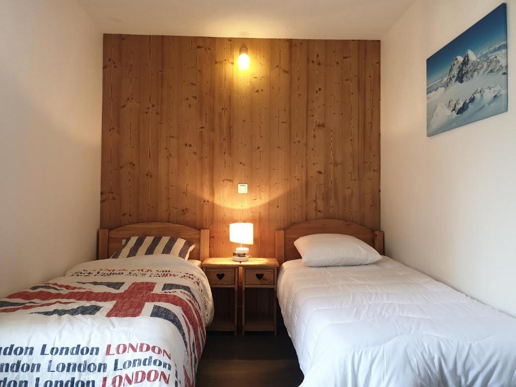 Postel nebo postele na pokoji v ubytování Olympic Appartements VTI