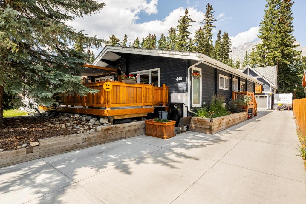 a home with a large wooden house at Cougar Street Mountain Rental in Banff
