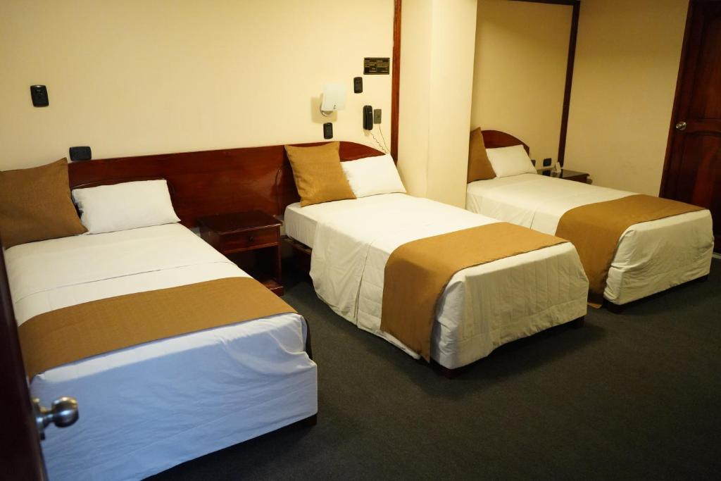 Letto o letti in una camera di Amara Hotel