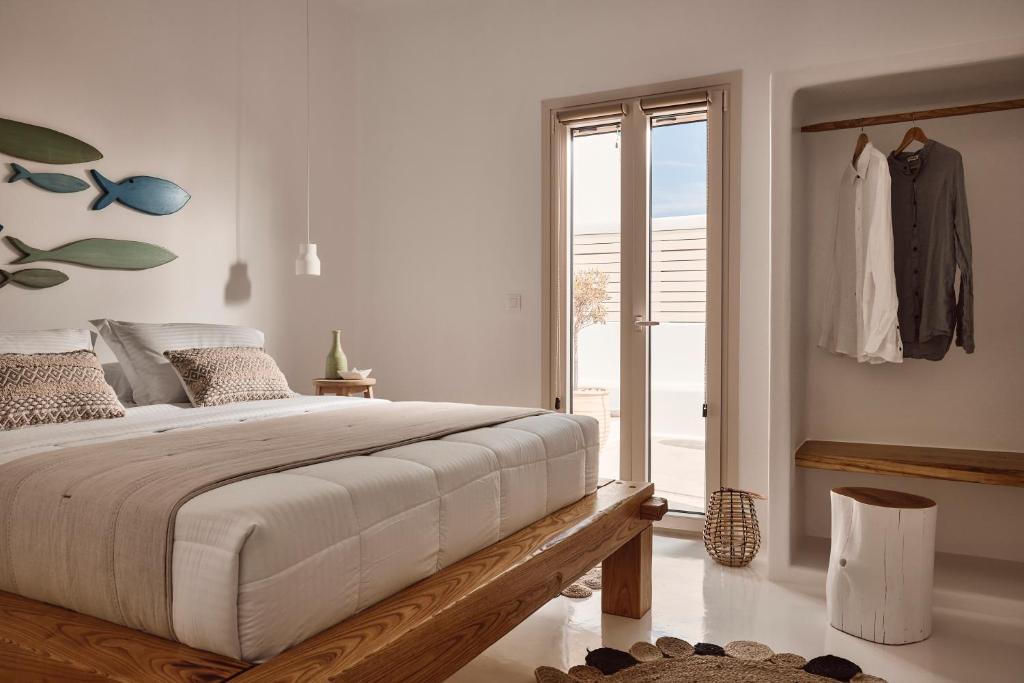 Postel nebo postele na pokoji v ubytování Infinity Villa milos