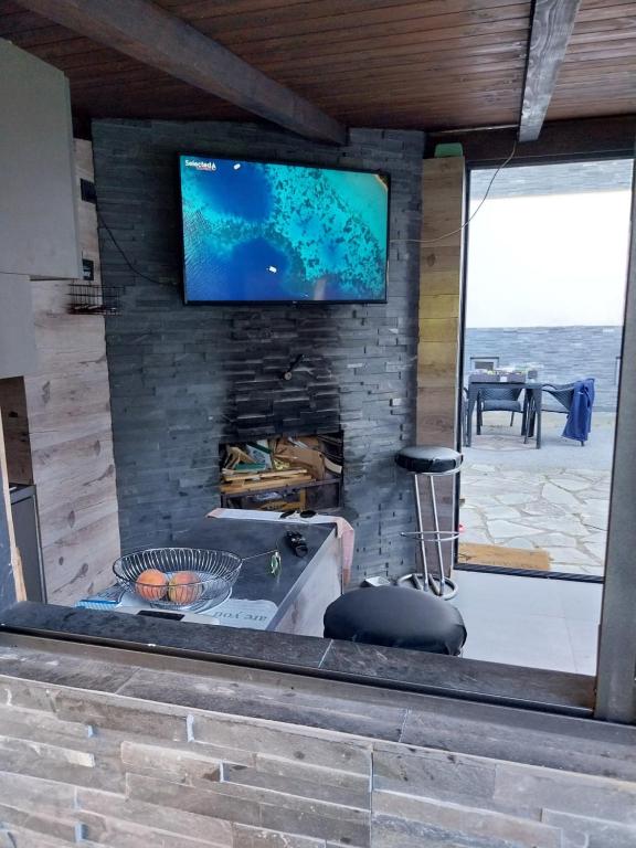 TV a/nebo společenská místnost v ubytování Aspen