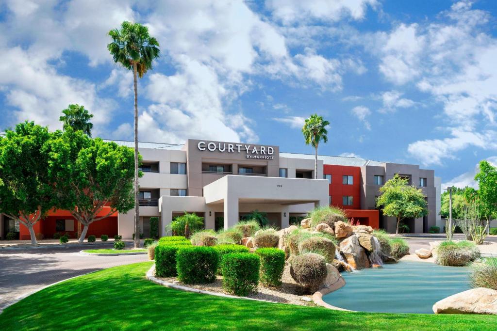 a building with a garden in front of it at Courtyard Scottsdale North in Scottsdale