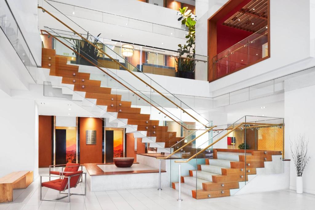 a staircase in a building with a lobby at Delta Hotels by Marriott Ottawa City Centre in Ottawa