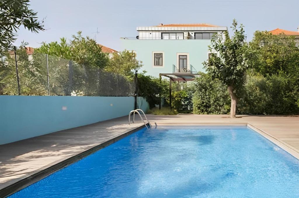 a swimming pool in the backyard of a house at Porto Pool Spot in Porto