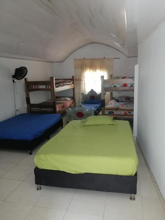 Postel nebo postele na pokoji v ubytování casa de relajación lowcost