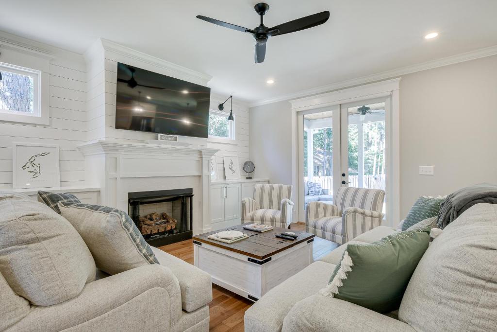 a living room with two couches and a fireplace at North Carolina Home about 2 Mi to Pinehurst Resort in Pinehurst