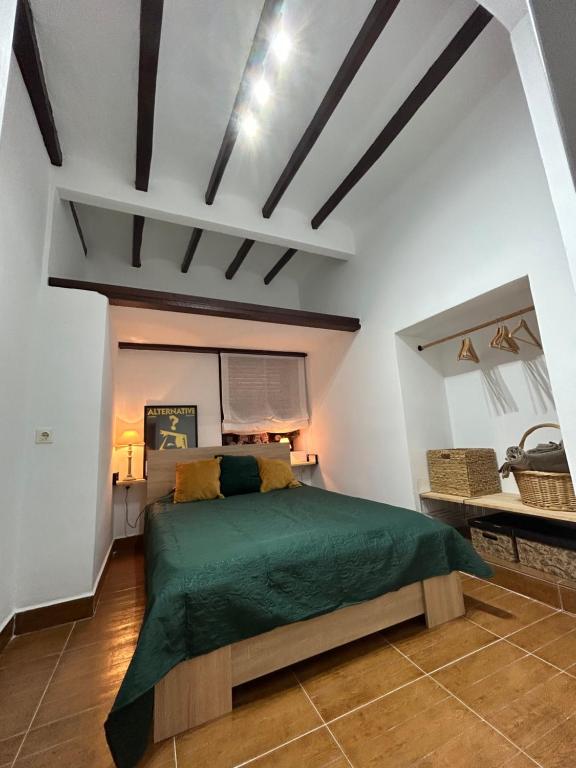 a bedroom with a green bed in a room at Private apartment in the Old Town "Center&Beach" in Benidorm