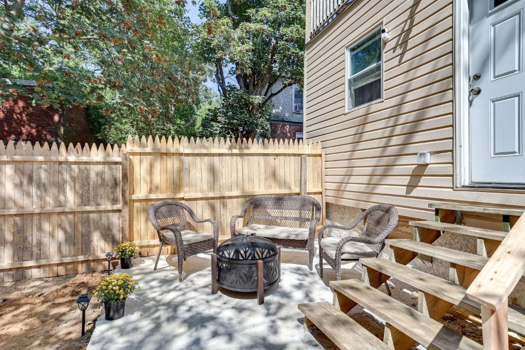 a patio with chairs and a table and a fence at Wilmington Home about 28 Mi to Downtown Philadelphia! in Wilmington