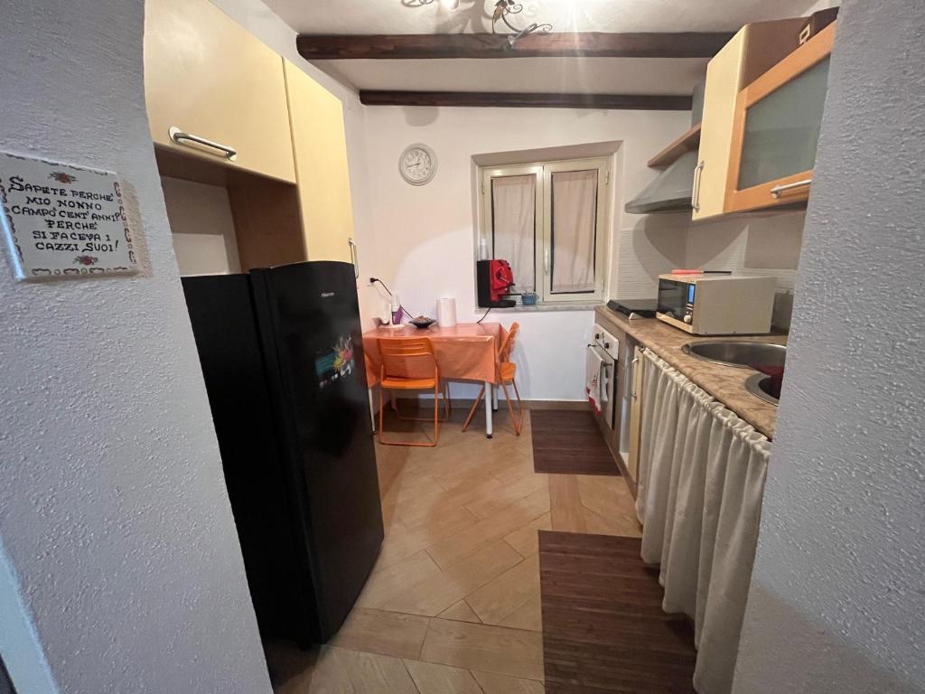 Kuchyň nebo kuchyňský kout v ubytování Camera relax riservata intero appartamento