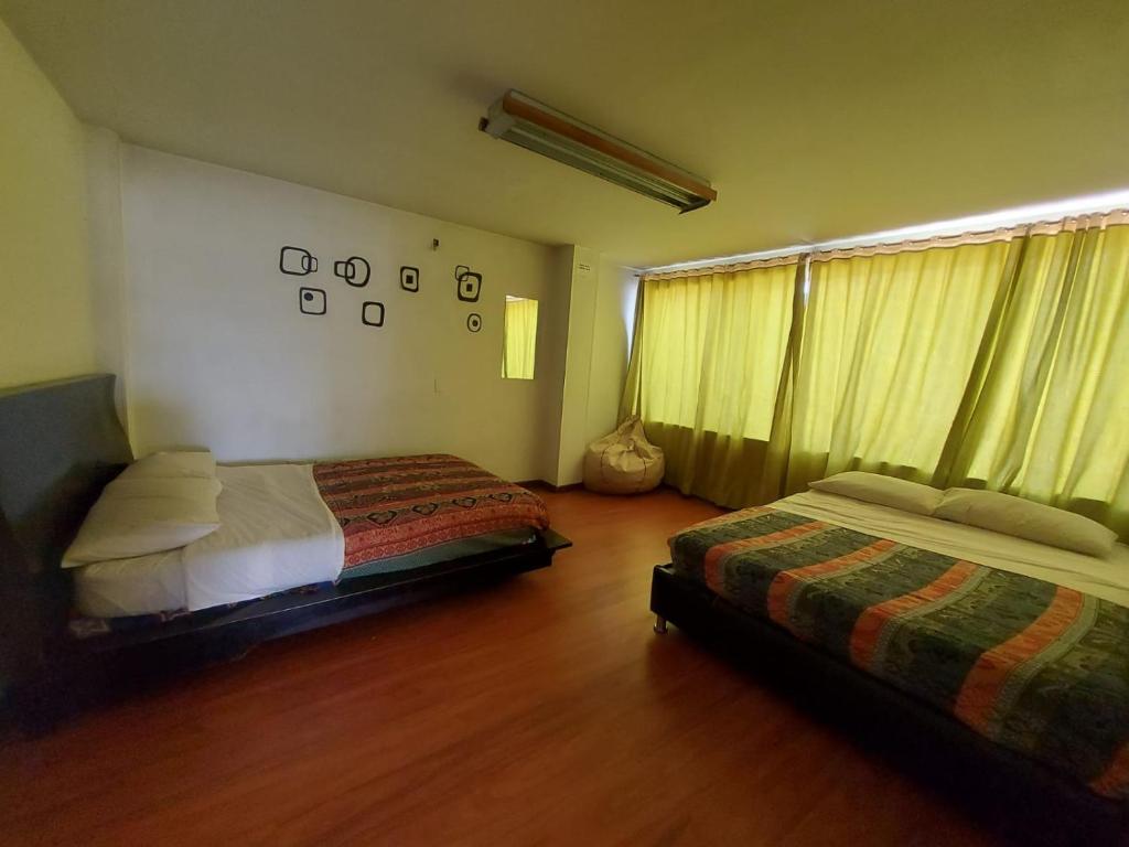 Postel nebo postele na pokoji v ubytování North House Hostel