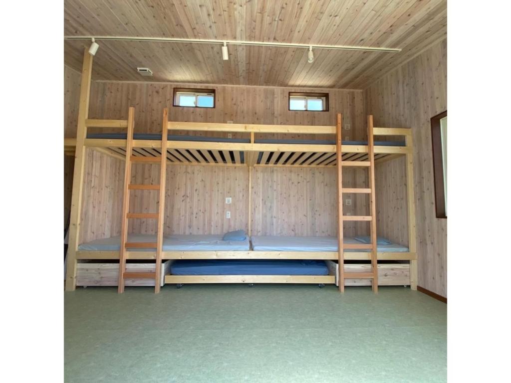 a room with two bunk beds in it at Kai sou - Vacation STAY 42232v in Tateyama