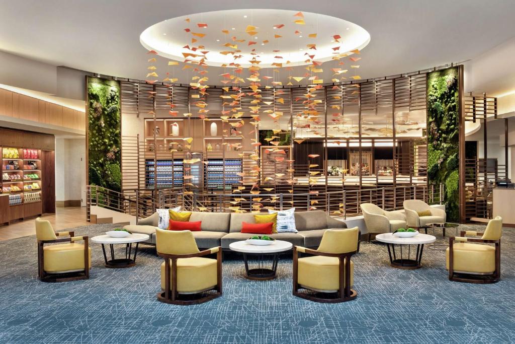 a lobby with a couch and tables and chairs at DoubleTree by Hilton Chicago Magnificent Mile in Chicago