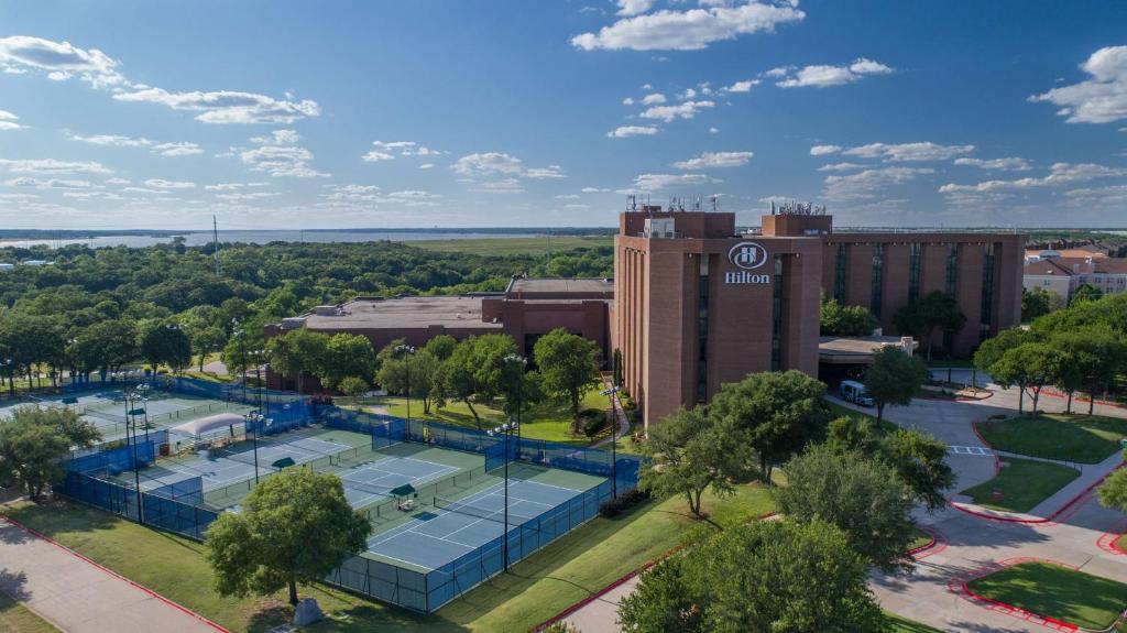 an overhead view of a hotel with tennis courts at Hilton DFW Lakes Executive Conference Center in Grapevine