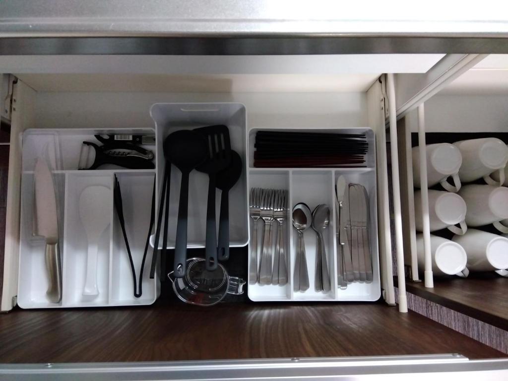 a drawer filled with utensils on a shelf at Tsunageru Aomori Yasukata - Vacation STAY 40732v in Aomori