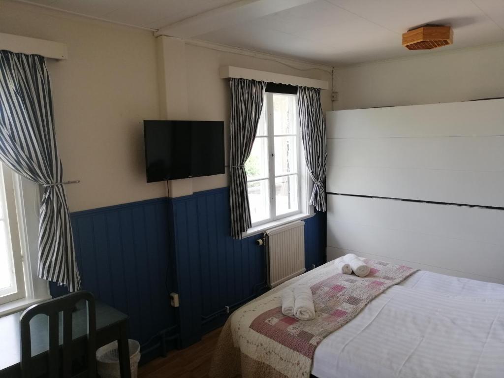 Postel nebo postele na pokoji v ubytování Lugnet Malung Hotell