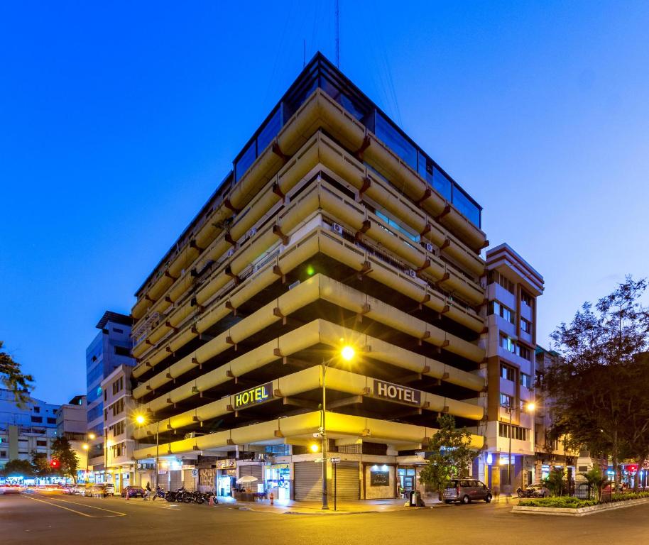 a large building with the hotel on the side of it at Hotel Malecon Inn in Guayaquil