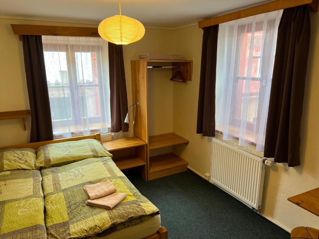 Postel nebo postele na pokoji v ubytování Hostel Postel