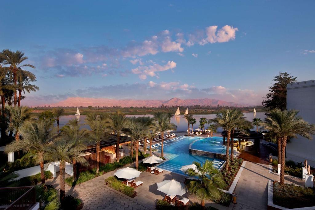 an overhead view of a resort with a pool and palm trees at Hilton Luxor Resort & Spa in Luxor